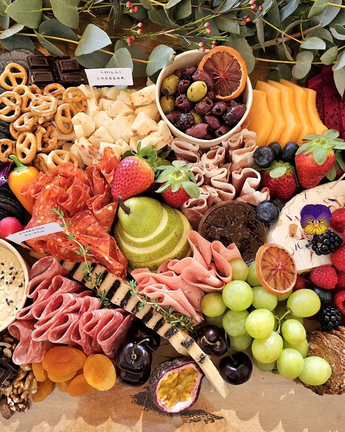 Fresh fruit, cheeses and charcuterie in a generous Happy Belly grazing spread